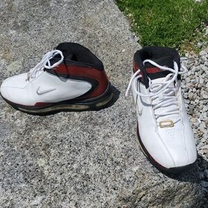 Vintage Nike White and Black Athletic Shoes with Mid-Top Design